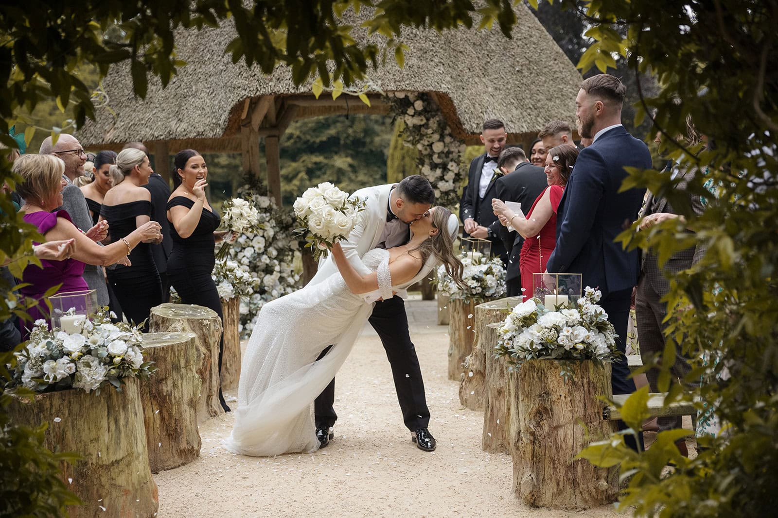 The Orangery Kent wedding photography; outdoor confetti dip wedding photo; professional Kent wedding videographer; Scott Miller Experience ceremony exit.