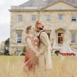 Wedding couple in vintage attire at an Essex estate.