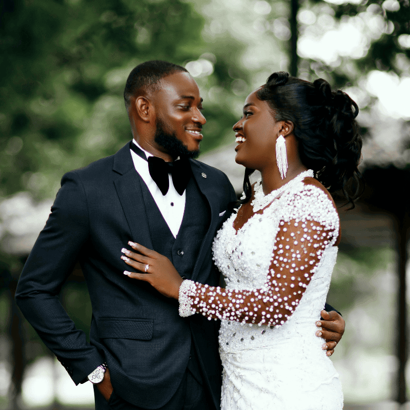 Wedding couple smiling in formal attire outdoors in Essex, captured by Scott Miller Photography.