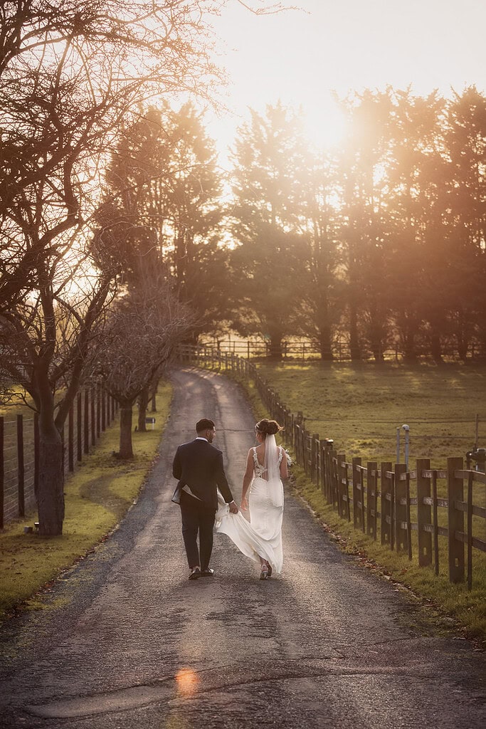 Professional Parklands Quendon Hall wedding photography; candid bride and groom walk Essex; relaxed wedding photographer and videographer; Scott Miller style.